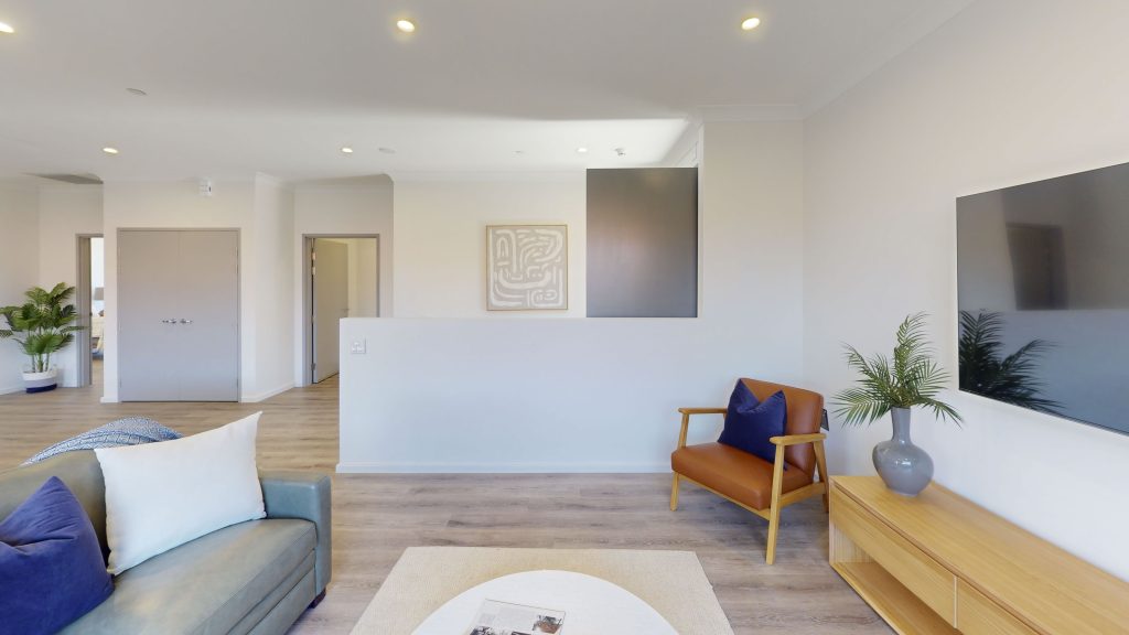 An interior image showing the main living area of one of the homes at Grant Lewis Court in Gosnells. It is a bright and airy space with wide hallways and is very generously sized.
